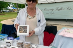 Jan, holding up a box of her delicious Door County Toffee created from her family recipe.