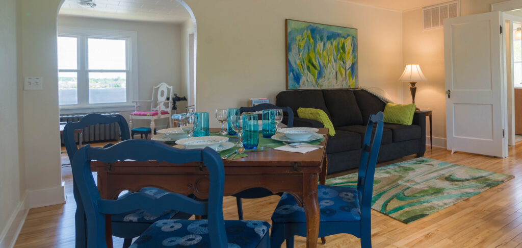 Eagle View Suite dining area and water background.